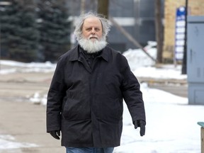 Todd Rogers walks to a bus stop after leaving the London courthouse Tuesday Feb. 11, 2020, where he was sentenced to 36 months probation for threatening to bomb the London Abused Women's Centre in London, Ont. (Derek Ruttan/The London Free Press)