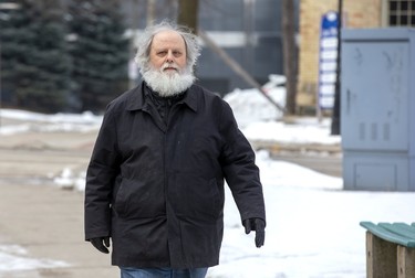 Todd Rogers walks to a bus stop after leaving the London courthouse Tuesday Feb. 11, 2020, where he was sentenced to 36 months probation for threatening to bomb the London Abused Women's Centre in London, Ont. (Derek Ruttan/The London Free Press)