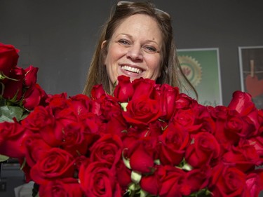 Kelly Kailis, vice-president of Forest of Flowers, and her staff in London have been handling thousands of roses in preparation for Valentine's Day. (Derek Ruttan/The London Free Press)
