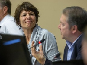 Coun. Anna Hopkins listens Thursday to Coun. Paul Van Meerbergen say the city already has done a lot to fight against climate change. Council voted to spend $1.3 million to address the issue. Van Meerbergen and Coun. Steve Hillier voted against the proposal. (DEREK RUTTAN, The London Free Press)