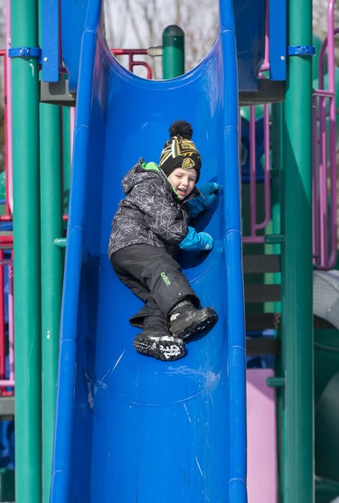 Four-year-old Keegan Kasubeck enjoyed Family Day weekend by playing on playground equipment at Pinafore Park  in St. Thomas on Sunday February 16, 2020. He was there with his sister Avery and mom Jenna. Derek Ruttan/The London Free Press/Postmedia Network