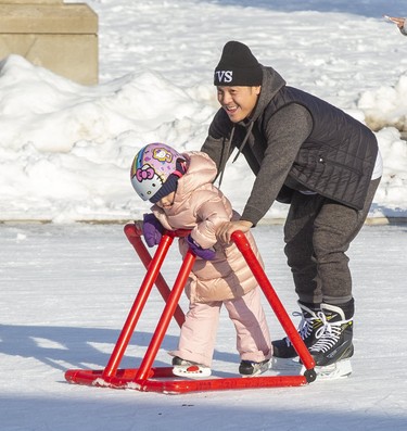 Truong Vo and his four-year-old daughter Aria skate at Victoria Park in London on Sunday February 16, 2020. Derek Ruttan/The London Free Press/Postmedia Network