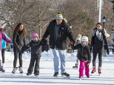 Mike Fayad skates with his daughter Madena (7) (left) and niece Lianna Assaf (8) at Victoria Park in London on Sunday February 16, 2020. Derek Ruttan/The London Free Press/Postmedia Network