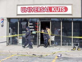 The Ontario Fire Marshal, London Fire Department and London Police Department investigate an explosion and fire inside a barber shop in London, Ont. on Monday Feb. 17, 2020. The explosion occurred shortly after midnight Sunday morning. Derek Ruttan/The London Free Press