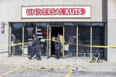 The Ontario Fire Marshal, London Fire Department and London Police Department investigate an explosion and fire inside a barber shop in London, Ont. on Monday Feb. 17, 2020. The explosion occurred shortly after midnight Sunday morning. Derek Ruttan/The London Free Press