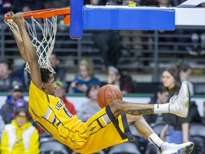 Marcus Capers of the London Lightning makes a swinging dunk against the Kitchener-Waterloo Titans during their game at Budweiser Gardens in London, Ont. on Monday Feb. 17, 2020. Derek Ruttan/The London Free Press