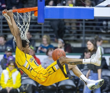 Marcus Capers of the London Lightning makes a swinging dunk against the Kitchener-Waterloo Titans during their game in London, Ont. on Monday February 17, 2020. Derek Ruttan/The London Free Press/Postmedia Network