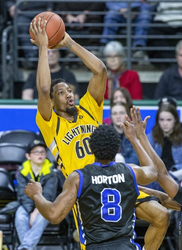 Marcus Capers of the London Lightning takes a shot over Ed Horton of the Kitchener-Waterloo Titans during their game at Budweiser Gardens in London, Ont. on Monday Feb. 17, 2020. Derek Ruttan/The London Free Press