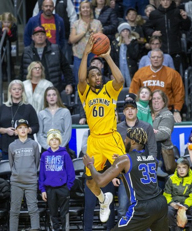 Marcus Capers of the London Lightning shoots over Jonathan Harris of the Kitchener-Waterloo Titans during their game at Budweiser Gardens in London, Ont. on Monday Feb. 17, 2020. Derek Ruttan/The London Free Press