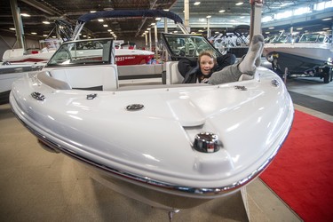Eight-year-old Brody Ball takes a relaxing pose in a 6.4 metre long Four Winns H210 bowrider during the London Boat, Fishing and Outdoor Show at the Western Fair Agriplex in London, Ont. on Friday February 21, 2020. The show featues 100,000 square feet of summertime fun including 250 boats. Brody was attending the show with his grandfather Ken Ball. Both are from London. Derek Ruttan/The London Free Press/Postmedia Network