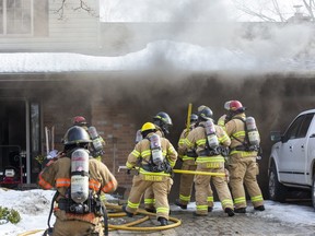 One resident was taken to hospital as a precaution after escaping a house fire at 190 Wychwood Park in London, Ont. on Monday February 24, 2020. Twenty firefighters teamed up to put out the fire. A preliminary damage estimate was set at $300,00 to $400,000.Derek Ruttan/The London Free Press/Postmedia Network