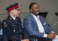 Police chief Stephen Williams laughs with Cleveland Brownlee prior to the London Majors star's keynote speech at the Lewis Coray Trailblazer Awards Evening of Inspiration at police headquarters in London, Ont. The Trailblazer Awards were created nine years ago in honour of Sergeant (Ret.) Lewis 'Bud' Coray, London's first black police officer. (Derek Ruttan/The London Free Press)