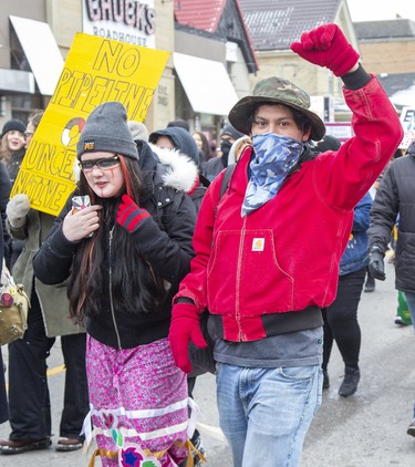 Protestors march north on Richmond Street on way to the  CP rail tracks at Waterloo Street and Pall Mall Street  in London, Ont. on Friday February 28, 2020. The group of approximately 300 people occupied the tracks in support of Wet'suwet'en hereditary chiefs. Derek Ruttan/The London Free Press/Postmedia Network