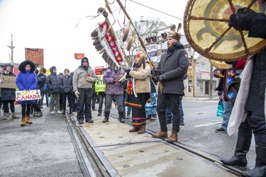 Chief of the Chippewas of Kettle and Stony Point First Nation Jason Henry and elder Patricia Shawnoo stand on CP Rail tracks at Richmond Street where they stopped for fifteen minutes before continuing to lead protestors to the  CP Rail tracks at Waterloo Street and Pall Mall Street  in London, Ont. on Friday February 28, 2020. The group of approximately 300 people occupied the tracks in support of Wet'suwet'en hereditary chiefs. Derek Ruttan/The London Free Press/Postmedia Network