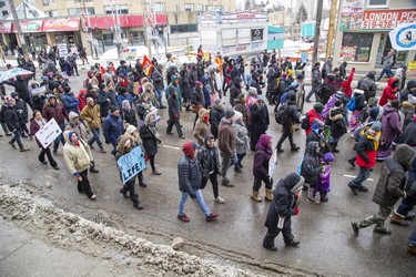 Protestors march north on Richmond Street on way to the  CP rail tracks at Waterloo Street and Pall Mall Street  in London, Ont. on Friday February 28, 2020. The group of approximately 300 people occupied the tracks in support of Wet'suwet'en hereditary chiefs. Derek Ruttan/The London Free Press/Postmedia Network