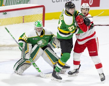Kirill Steklov of the London Knights battles with Tye Kartye of the Soo Greyhounds in front of Knights goalie Brett Brochu during the first period of their game in London, Ont. (Derek Ruttan/The London Free Press)