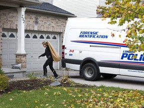 Members of the forensic identification section were collecting evidence  from 252 South Leaksdale Circle in London in this Free Press file photo. Oluwatobi Boyede lived there.