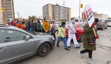 Teachers from Saunders Secondary, Westminster SS, Jean Vanier Catholic Elementary and Westmount Public School cross a gridlocked Wonderland Road as they picket in London, Ont.. Photograph taken on Tuesday February 4, 2020.  Mike Hensen/The London Free Press/Postmedia Network