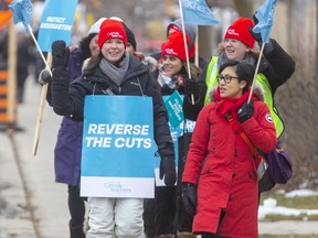 Teachers picket on Wonderland Road in London as part of a strike on Tuesday by many of the province's teachers unions. (Mike Hensen/The London Free Press)