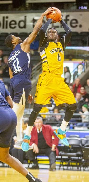 Marvin Binney of the London Lightning goes up for a jumper but gets stuffed by veteran Cliff Clinkscales of the Halifax Hurricanes during their Sunday afternoon game at Budweiser Gardens in London. Photograph taken on Sunday February 9, 2020. Mike Hensen/The London Free Press/Postmedia Network