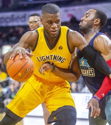 Abednego Lufile of the London Lightning muscles in on Joel Kindred of the Halifax Hurricanes during their Sunday afternoon game at Budweiser Gardens in London. 
Photograph taken on Sunday February 9, 2020. Mike Hensen/The London Free Press/Postmedia Network