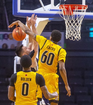 Kye Arseneault of the Halifax Hurricanes gets stuffed by Marcus Capers of the Lightning during their Sunday afternoon game at Budweiser Gardens in London. 
Photograph taken on Sunday February 9, 2020. Mike Hensen/The London Free Press/Postmedia Network