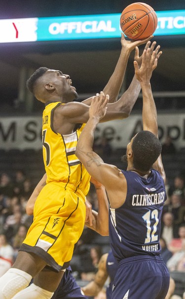 Otas Iyekekpolor of the London Lightning lays it up over Cliff Clinkscales of the Halifax Hurricanes during their Sunday afternoon game at Budweiser Gardens in London. 
Photograph taken on Sunday February 9, 2020. Mike Hensen/The London Free Press/Postmedia Network