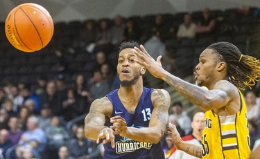 Joel Kindred of the Halifax Hurricanes passes the ball inside while being guarded by AJ Gaines of the London Lightning during their Sunday afternoon game at Budweiser Gardens in London. 
Photograph taken on Sunday February 9, 2020. Mike Hensen/The London Free Press/Postmedia Network