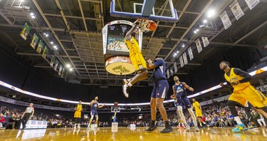 Randy Phillips of the London Lightning dunks over Carl Hall of the Halifax Hurricanes during their Sunday afternoon game at Budweiser Gardens in London. 
Photograph taken on Sunday February 9, 2020. Mike Hensen/The London Free Press/Postmedia Network