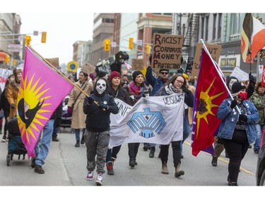 A large group of protesters heads west on  Dundas Street from Wellington Street Tuesday Feb. 11, 2020, on their way to Richmond Street, then Queens Avenue to RCMP offices on Talbot Street.  London protesters were showing solidarity with the Wet'suwet'en Nation which is blockading the Coastal GasLink pipeline in B.C. Mike Hensen/The London Free Press