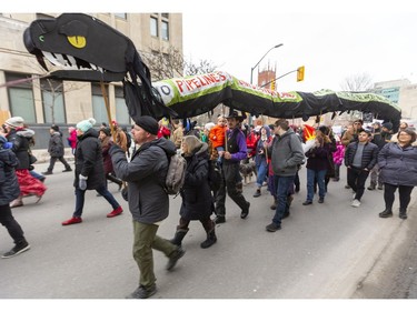 A large group of protesters turns onto  Dundas Street from Wellington Street Tuesday Feb. 11, 2020, heading to Richmond Street, then Queens Avenue to RCMP offices on Talbot Street.  London protesters were showing solidarity with the Wet'suwet'en Nation which is blockading the Coastal GasLink pipeline in B.C. Mike Hensen/The London Free Press