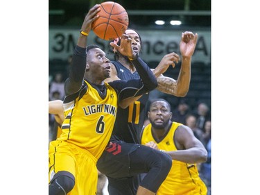 Marvin Binney of the Lightning drives in on Marlon Johnson of the Sudbury Five during their NBL game at Budweiser Gardens in London, on Thursday February 13, 2020.  Mike Hensen/The London Free Press/Postmedia Network