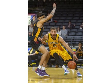 Garrett Williamson of the Lightning drives baseline on Josiah Moore of the Sudbury Five during their NBL game at Budweiser Gardens in London, on Thursday February 13, 2020.  Mike Hensen/The London Free Press/Postmedia Network