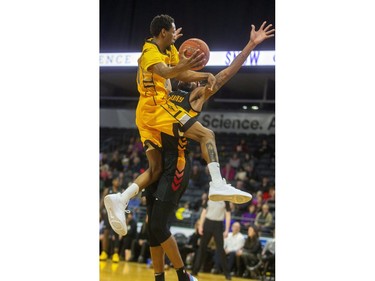 Marcus Capers of the Lightning drives on Marlon Johnson of the Sudbury Five during their NBL game at Budweiser Gardens in London, on Thursday February 13, 2020.  Mike Hensen/The London Free Press/Postmedia Network