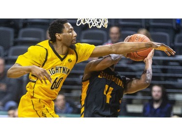 Marcus Capers of the Lightning tries for another stuff as he stops Sudbury's Dexter Williams baseline during their NBL game at Budweiser Gardens in London, on Thursday Feb. 13, 2020.  Mike Hensen/The London Free Press