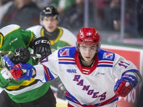 Knights forward Luke Evangelista and Kitchener's Mike Petizian fight for position near the boards in the Knights end during the first period of their Friday night game at Budweiser Gardens in London. Photograph taken on Friday February 14, 2020. 
Mike Hensen/The London Free Press/Postmedia Network