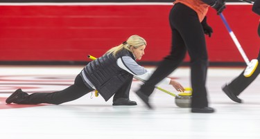 Sherry Middaugh delivers a rock in the first end of their senior women's provincial curling championship match Sunday against the rink of Colleen Madonia at the St. Thomas Curling Club. Middaugh claimed the championship with a 6-3, seven-round match. Mike Hensen/The London Free Press/Postmedia Network
