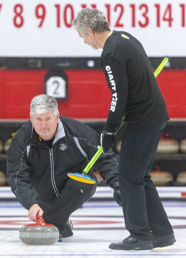 Bob Armstrong delivers a rock in the second end of his team's senior men's provincial championship match Sunday at the St. Thomas Curling Club. The Armstrong rink out of Ingersoll faced Howard Rajala of Rideau, who scored three in the first end and then held on for a 7-5 win over the local rink. Mike Hensen/The London Free Press/Postmedia Network
