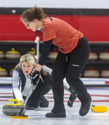 Sherry Middaugh delivers a rock in the second end of her team's senior women's provincial curling championship match Sunday against the rink of Colleen Madonia at the St. Thomas Curling Club. Middaugh claimed the championship with a 6-3, seven-round match.  Mike Hensen/The London Free Press/Postmedia Network