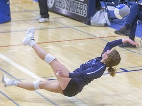 Lucas' Ally Gardner dives and rotates trying to save a ball during one of the marathon exchanges between the Vikings and the Saunders Sabres during their WOSSAA AAA semi-final game at CCH in London, Ont.  Photograph taken on Tuesday February 25, 2020.  Mike Hensen/The London Free Press/Postmedia Network