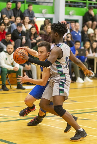 Beal's JC Cruz drives in on Laurier's Daniel Anane during their WOSSAA AAA senior boys semi-final played at Laurier on Wednesday February 26, 2020. Last week in the city final, Beal won 79-59, but Beal coach Brian Harvey said, "it's tough to beat a team twice in a row, and their home gym is worth 10pts."
And it was, after trailing throughout the first half, a rousing third quarter had the teams tied at 33 heading into the fourth.
The fourth didn't disappoint with Laurier's raucous home gym keeping the team fired up, with Beal leading 47-46 with 4.4 seconds to play, a basket made it 49-46 with 3 seconds and then a technical foul made it 50-46 for the final.
Beal will face CCH in the WOSSAA AAA final.
Mike Hensen/The London Free Press/Postmedia Network