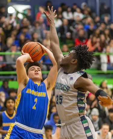 Beal's J C Cruz goes for the jumper over Laurier's Daniel Anane during their WOSSAA AAA senior boys semi-final played at Laurier on Wednesday February 26, 2020. Last week in the city final, Beal won 79-59, but Beal coach Brian Harvey said, "it's tough to beat a team twice in a row, and their home gym is worth 10pts."
And it was, after trailing throughout the first half, a rousing third quarter had the teams tied at 33 heading into the fourth.
The fourth didn't disappoint with Laurier's raucous home gym keeping the team fired up, with Beal leading 47-46 with 4.4 seconds to play, a basket made it 49-46 with 3 seconds and then a technical foul made it 50-46 for the final.
Beal will face CCH in the WOSSAA AAA final.
Mike Hensen/The London Free Press/Postmedia Network