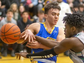 Beal's J.C. Cruz loses the ball on the baseline as he's guarded by Laurier's Daniel Anane during their WOSSAA AAA senior boys' semi-final played at Laurier on Wednesday Feb. 26, 2020. 
Last week, after Beal beat Laurier 79-59 in the city final, Beal coach Brian Harvey said,  "it's tough to beat a team twice in a row, and their home gym is worth 10 points." And it was. After trailing throughout the first half, a rousing third quarter had the teams tied at 33 heading into the fourth. The fourth didn't disappoint with Laurier's raucous home gym keeping the team fired up, with Beal leading 47-46 with 4.4 seconds to play, a basket made it 49-46 with three seconds and then a technical foul made it 50-46 for the final. Beal will face Catholic Central in the WOSSAA AAA final.
Mike Hensen/The London Free Press