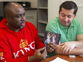 Dilou Bhai Kakule, from the Democratic Republic of the Congo, makes up a story about his daughters learning ballet for classmates, including Mauricio Arbodieda of Colombia, at an English as a second language program at the Centre for Lifelong Learning on King Street in London. Teacher Maria Karidas says the project is fun, but also teaches writing, reading and speaking skills. (Mike Hensen/The London Free Press)