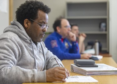 Keflay Hainom from Eritrea takes notes during his English as a Second Language program at the Centre for LIfelong Learning on King Street in London, Ont.   Photograph taken on Thursday February 27, 2020.  Mike Hensen/The London Free Press/Postmedia Network