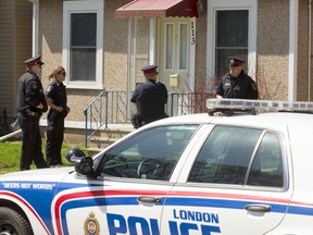 Police on the scene following a standoff at 113 Madison Ave., London, Ont. on Tuesday April 28, 2015. (Free Press file photo)