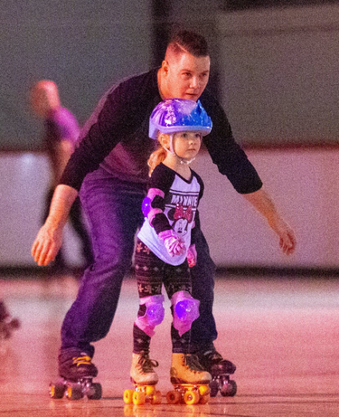 Ian Kirby roller skates with his four-year-old daughter Inara at the North London Optimist Community Centre in London on Sunday. Derek Ruttan/The London Free Press/Postmedia Network