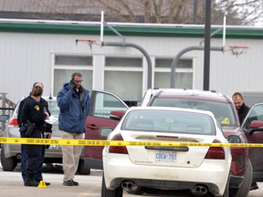 OPP officers work with Stratford police to gather evidence after a woman was stabbed several times outside Little Falls public school in St. Marys Wednesday morning. Galen Simmons/The Beacon Herald