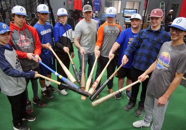 Seventeen players from Oshawa Legionaires Elite baseball teams joined Trevor Oakes (centre) at ABO Baseball in Tillsonburg Saturday for a unique experience. Oakes made bats for each of the players - while they watched. The 17U, 16U and 15U players also tried out the batting cages, gym area, and golf simulator. (Chris Abbott/Tillsonburg News) ORG XMIT: POS2002032056331479