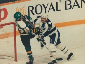 Wendel Clark is shown in fine form during a game against Minnesota during his tenure with the Toronto Maple Leafs (Craig Roberston/Toronto Sun)